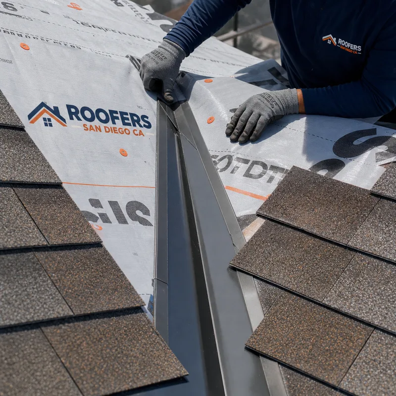 Cleanly finished roof valley with properly lapped underlayment and neat metalwork